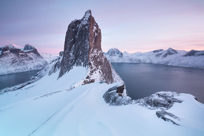 Scenic view of snowcapped mountains against sky during sunset