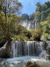 Scenic view of waterfall in forest during autumn