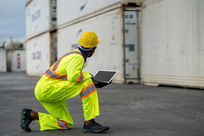 Rear view of man working