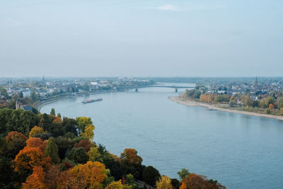 High angle view of river and buildings against sky