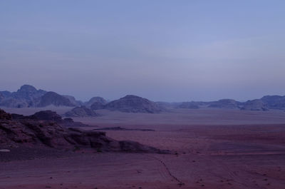 Scenic view of wadi rum against clear sky during sunset