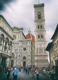 People in front of historical building