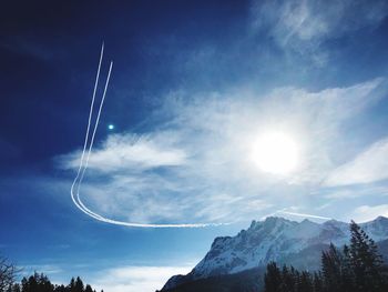 Low angle view of vapor trails in sky