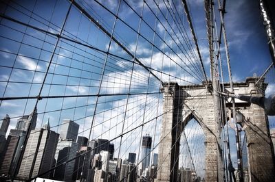 Low angle view of brooklyn bridge and city