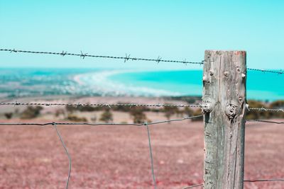 Close-up of barbed wire fence