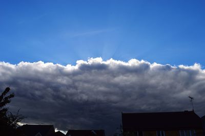 High section of building against cloudy sky