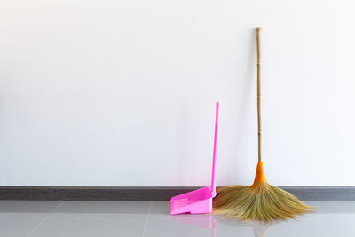 Close-up of multi colored pencils on floor against white background