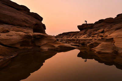 Low angle view of rock formations at sunset