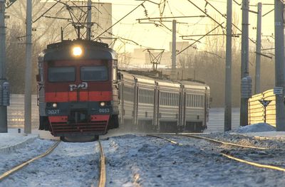 Train in railroad tracks during winter