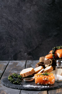 Close-up of food on table against black background