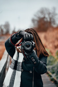 Midsection of person photographing