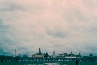 View of buildings against cloudy sky