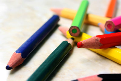 Close-up of colored pencils on table