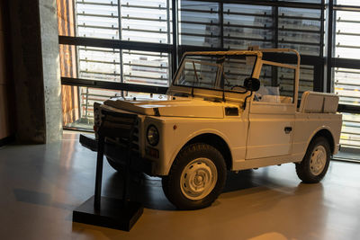 Vintage car on table by window