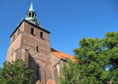 Low angle view of bell tower against blue sky