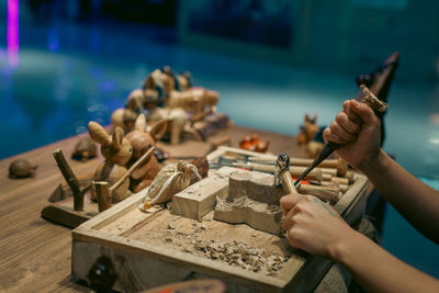 Cropped hand of man working on table