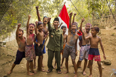 Portrait of people standing outdoors