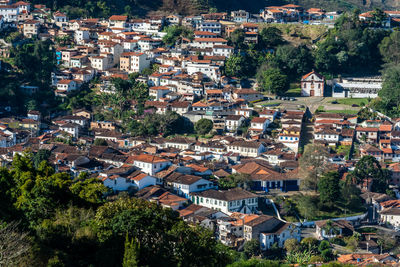 High angle view of townscape and trees in town