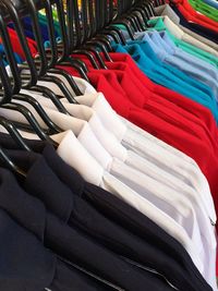 High angle view of multi colored shirts for sale in shop