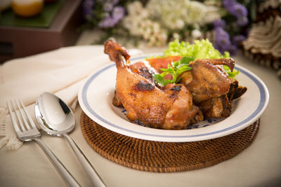 Close-up of fried chicken served on table