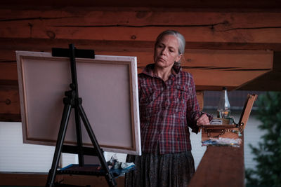 Portrait of young man working in workshop