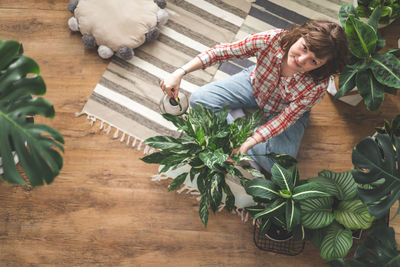 High angle view of woman sitting on table