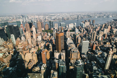 High angle view of modern buildings in city against sky