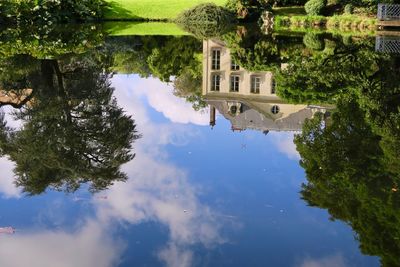 Reflection of building and trees in lake