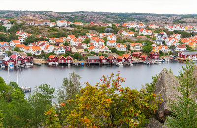 High angle view of townscape by lake against buildings