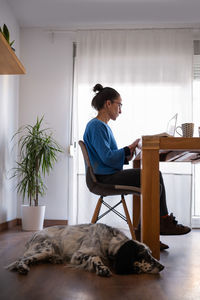 Young man using laptop at home