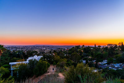 High angle view of townscape against clear sky at sunset