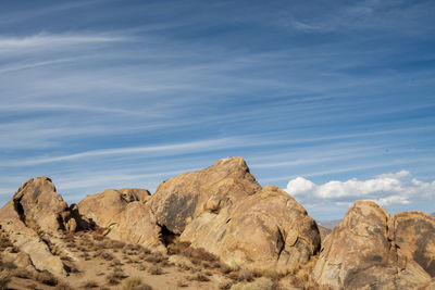 Rock formations in desert against sky