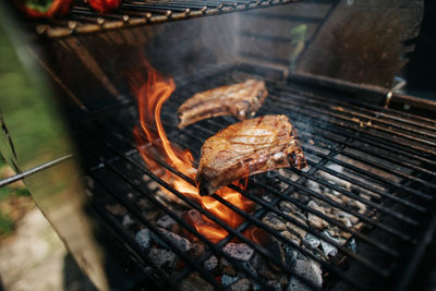 High angle view of meat on barbecue grill