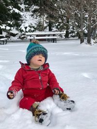 Boy playing on snow field