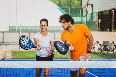 Tennis players playing at court