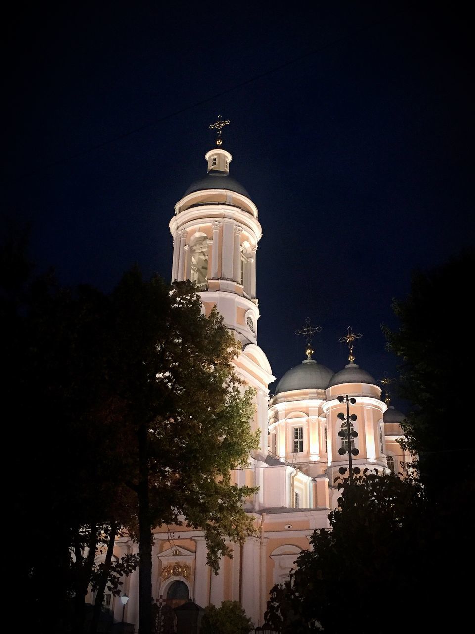 architecture, building exterior, night, built structure, tree, building, plant, darkness, religion, travel destinations, nature, sky, no people, place of worship, light, tower, evening, belief, illuminated, low angle view, history, lighting, the past, city, landmark, spirituality, dome, outdoors, travel