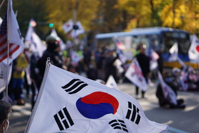 Rear view of people standing on street