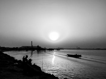 Scenic view of sea against clear sky during sunset