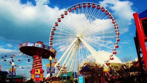 Low angle view of ferris wheel against sky