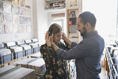 Young couple at record store