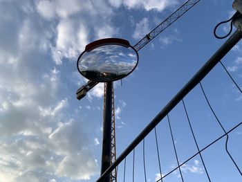 Low angle view of street light against sky