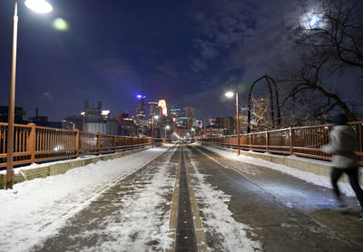 People walking on snow covered road