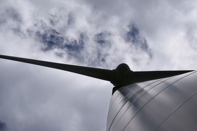 Low angle view of windmill against sky