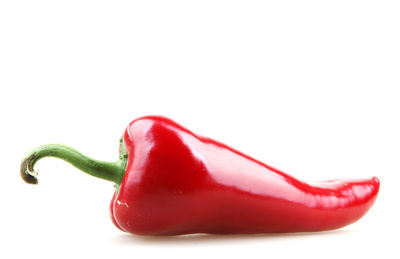 Close-up of red bell pepper against white background