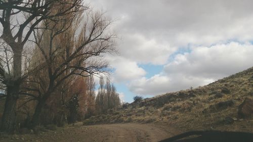 Scenic view of landscape against cloudy sky