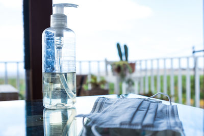 Close-up of glass bottle on table