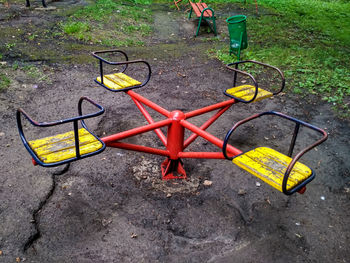 High angle view of empty chair on field