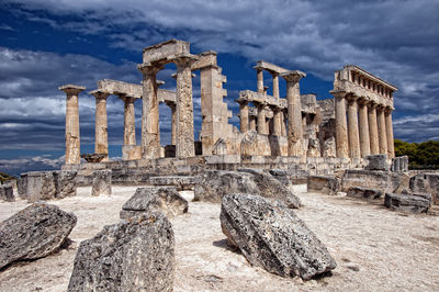 Old ruins of temple against cloudy sky