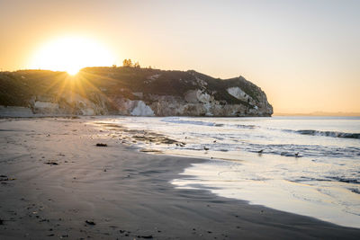 Scenic view of sea against clear sky during sunset