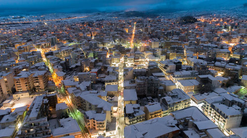 High angle view of illuminated buildings in city